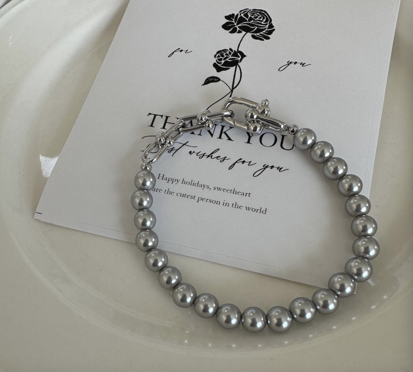 Grey faux pearl panelled horseshoe clasp bracelet