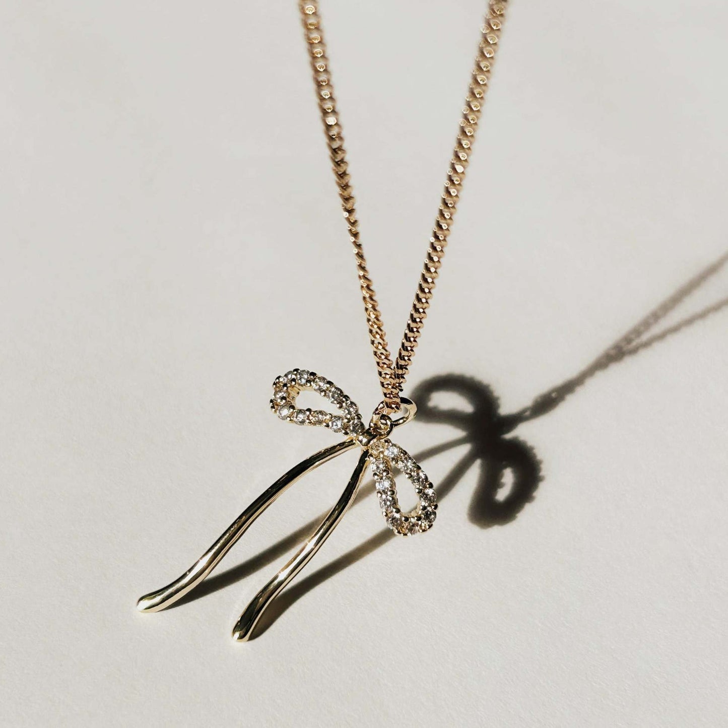 Stainless steel bow necklace