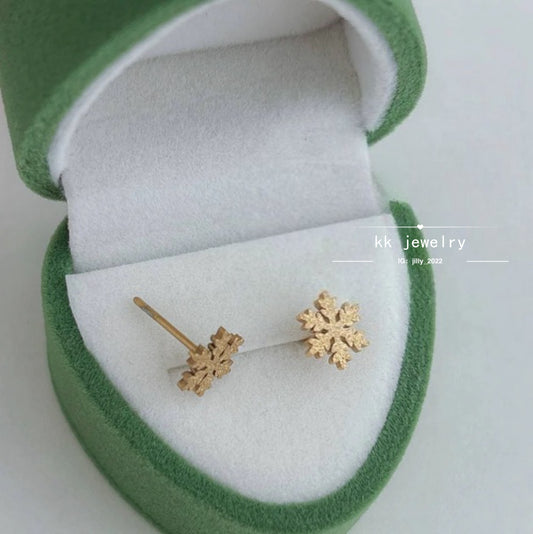 Two snowflake stud earrings