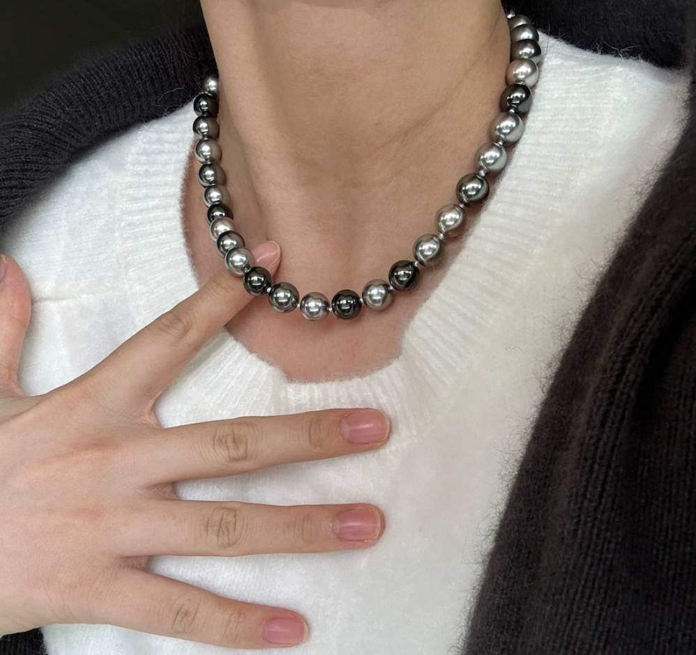 Necklace of faux melange gray-green pearls