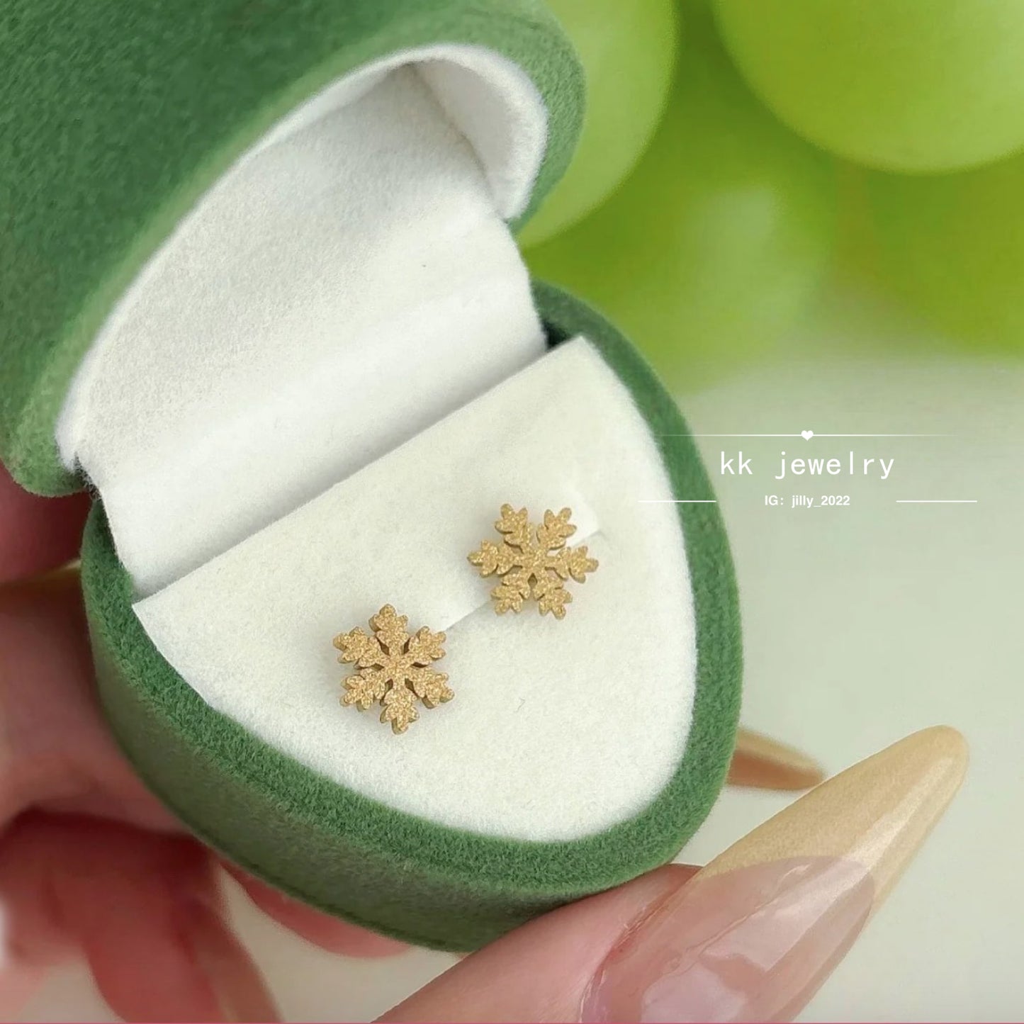 Two snowflake stud earrings