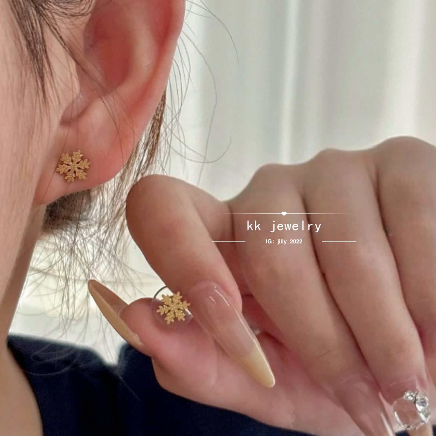 Two snowflake stud earrings