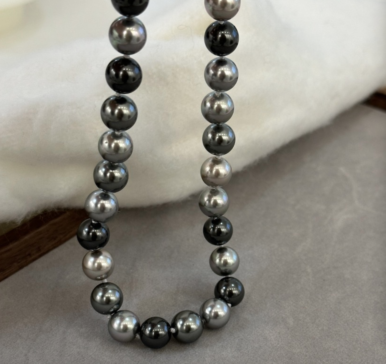 Necklace of faux melange gray-green pearls