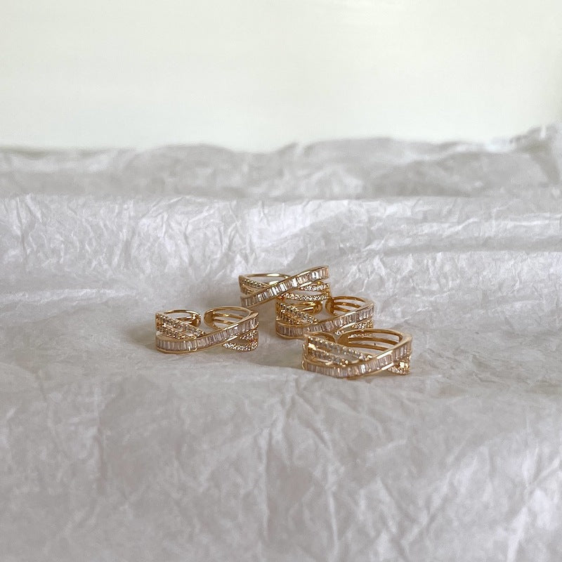 Cross-wrapped gold rings