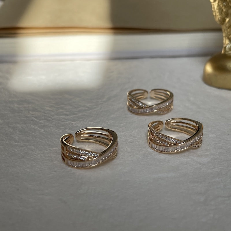 Cross-wrapped gold rings
