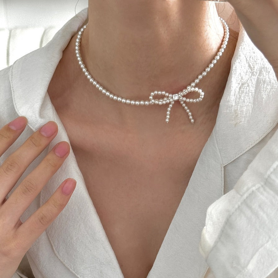 Sterling silver bow faux pearl gentle necklace