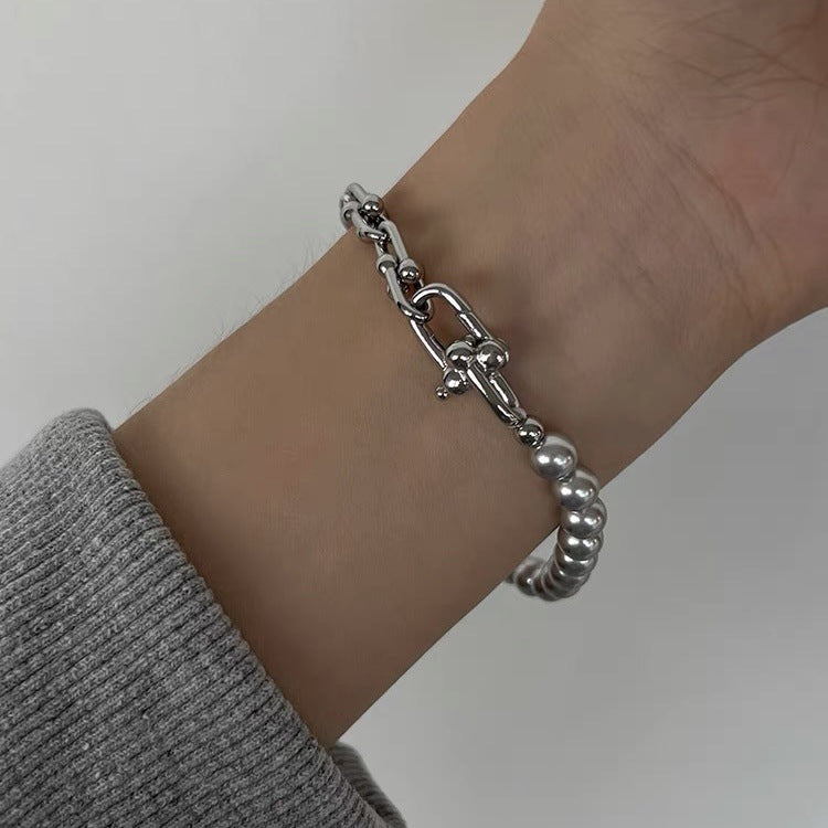 Grey faux pearl panelled horseshoe clasp bracelet