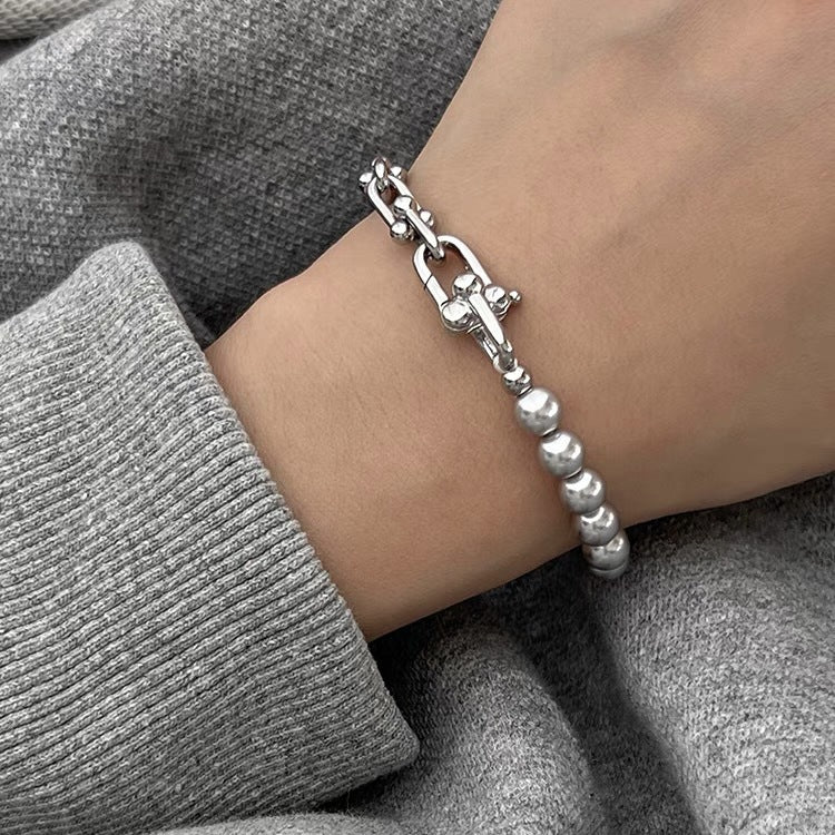 Grey faux pearl panelled horseshoe clasp bracelet